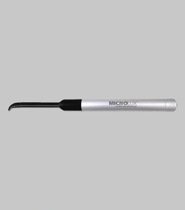 Dental instrument or pen on a gray background