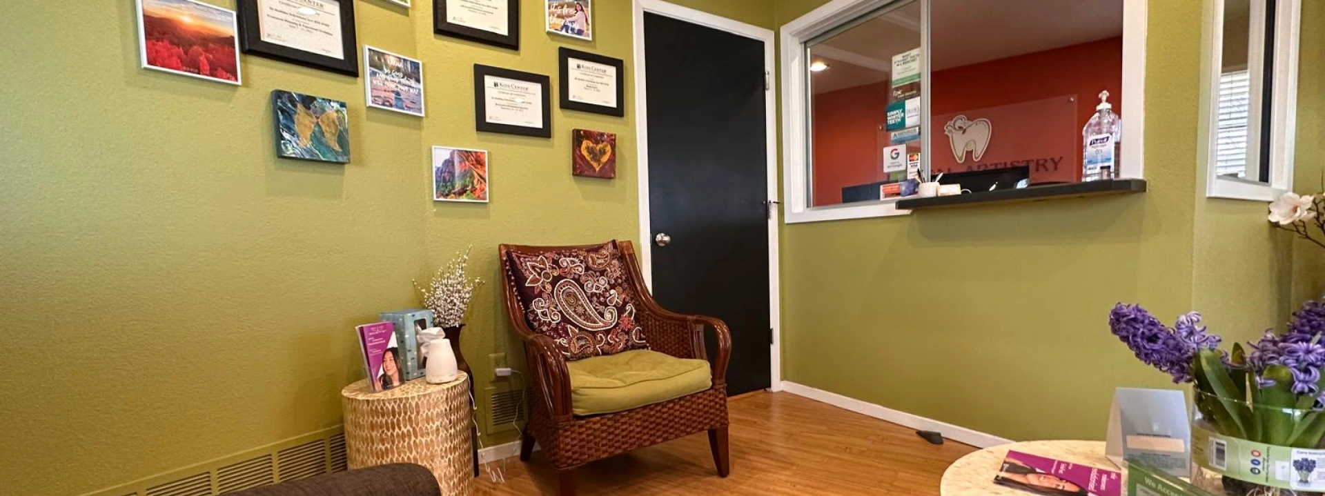 Dental Artistry Irving office hallway with wooden door and warm wall decor